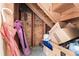 A cluttered storage area featuring wooden beams, exposed insulation, and boxes at 3251 Abbeywood Dr, Decatur, GA 30034