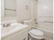 Bright bathroom features a single sink vanity, toilet, and shower-tub combo at 4895 Ozment Ridge Ct, Lithonia, GA 30038