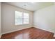 Bedroom featuring wood-look floors, a window, and light colored walls at 4895 Ozment Ridge Ct, Lithonia, GA 30038
