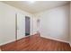 Bedroom showcasing wood-look flooring and an open doorway at 4895 Ozment Ridge Ct, Lithonia, GA 30038
