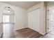 Hallway view showcasing archway, closet, and new floors at 4895 Ozment Ridge Ct, Lithonia, GA 30038