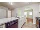 Modern kitchen featuring a dishwasher, sink and white countertops at 4895 Ozment Ridge Ct, Lithonia, GA 30038