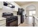 Kitchen featuring a sleek gas range and stainless-steel appliances perfect for cooking at 4895 Ozment Ridge Ct, Lithonia, GA 30038