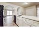 Stylish kitchen with stainless steel sink, white cabinets, and stainless-steel appliances at 4895 Ozment Ridge Ct, Lithonia, GA 30038