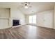 Spacious living room boasting a cozy fireplace and stylish hardwood floors, ideal for relaxation at 4895 Ozment Ridge Ct, Lithonia, GA 30038