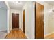 Inviting entryway with hardwood floors and a classic wood door, leading to a warm and welcoming home at 763 Brookwood Sw Ter, Lilburn, GA 30047
