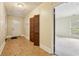 Inviting entryway with tile floors, coat closet, and access to additional room at 763 Brookwood Sw Ter, Lilburn, GA 30047