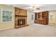 Inviting living room with a brick fireplace, built-in shelves, and ample natural light, creating a cozy atmosphere at 763 Brookwood Sw Ter, Lilburn, GA 30047