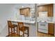Charming kitchenette with a breakfast bar and wooden counter stools at 1020 Austin Ne Ave, Atlanta, GA 30307