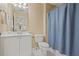 Simple bathroom featuring a white vanity and a light blue shower curtain at 4874 Registry Nw Ln, Kennesaw, GA 30152