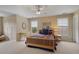 Bedroom featuring warm-toned walls, two large windows, and a bed dressed in a plaid comforter at 4874 Registry Nw Ln, Kennesaw, GA 30152