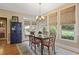 Dining room with view to the backyard, a wood table and vintage blue china cabinet at 4874 Registry Nw Ln, Kennesaw, GA 30152