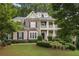 Charming two-story home featuring stone accents, dormer windows, front balcony and professionally landscaped front yard at 4874 Registry Nw Ln, Kennesaw, GA 30152