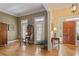 Welcoming foyer featuring hardwood floors, paneled walls, a wooden front door, and charming decor at 4874 Registry Nw Ln, Kennesaw, GA 30152