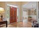 Gracious foyer with hardwood floors, a chandelier, and an elegant view into the formal dining room at 4874 Registry Nw Ln, Kennesaw, GA 30152