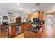 Kitchen area features hardwood floors, granite counters, stainless appliances, and a center island at 4874 Registry Nw Ln, Kennesaw, GA 30152