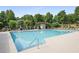 Community pool featuring plenty of deck chairs and a playground at 4874 Registry Nw Ln, Kennesaw, GA 30152