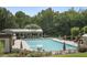 A community pool with lounge chairs and umbrellas offers a relaxing outdoor experience for residents at 4874 Registry Nw Ln, Kennesaw, GA 30152
