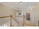 Staircase showcasing natural wood with views to a secondary room at 4874 Registry Nw Ln, Kennesaw, GA 30152