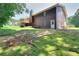 The large backyard features a mossy lawn and a view of the home's siding and a deck at 1123 Willow Trce, Grayson, GA 30017