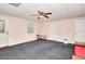 Finished basement with neutral carpet, white trim, a door leading to the outside, and light pink walls at 1123 Willow Trce, Grayson, GA 30017