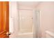 Bathroom features a shower and tub with neutral finishes and a towel rack adjacent to the shower at 1123 Willow Trce, Grayson, GA 30017