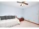 Bedroom showcases natural light, a ceiling fan, and soft blue walls at 1123 Willow Trce, Grayson, GA 30017
