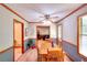 Bright dining room with wood flooring, blue wainscotting, and views of other rooms at 1123 Willow Trce, Grayson, GA 30017