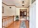 Inviting foyer features hardwood floors, wood trim, and a view into the living room at 1123 Willow Trce, Grayson, GA 30017