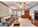 Comfortable living room with wainscotting, neutral carpet, and access to other rooms at 1123 Willow Trce, Grayson, GA 30017