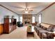 Cozy living room with a stone fireplace, neutral carpet, and ample natural light at 1123 Willow Trce, Grayson, GA 30017