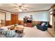 Spacious living room with a stone fireplace, neutral carpet, and views of other rooms at 1123 Willow Trce, Grayson, GA 30017