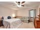 Bedroom with a ceiling fan, a dresser, and a window at 1123 Willow Trce, Grayson, GA 30017