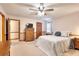Carpeted bedroom with ceiling fan, dresser, and neutral walls at 1123 Willow Trce, Grayson, GA 30017