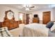 Spacious bedroom with dressers, ceiling fan, and ensuite bathroom at 1123 Willow Trce, Grayson, GA 30017