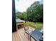 Back deck featuring seating with a wood floor and a view of the backyard and gazebo at 124 Dockside Downs Dr, Woodstock, GA 30189
