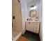 Modern bathroom featuring white shiplap walls, black fixtures, and chevron pattern floor in the shower at 124 Dockside Downs Dr, Woodstock, GA 30189