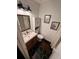 Stylish bathroom with black hexagon tile flooring, white subway tile shower and floating wood vanity at 124 Dockside Downs Dr, Woodstock, GA 30189