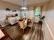 Elegant dining room with a stylish table setting, designer lighting, and neutral color palette at 124 Dockside Downs Dr, Woodstock, GA 30189