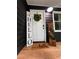 A welcoming front door enhanced by decorative elements, creating an inviting entrance at 124 Dockside Downs Dr, Woodstock, GA 30189