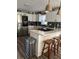 Modern kitchen featuring stainless steel appliances, a center island, and pendant lighting at 124 Dockside Downs Dr, Woodstock, GA 30189