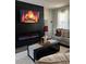 Chic living room with a modern fireplace, complemented by sleek furnishings and decor at 124 Dockside Downs Dr, Woodstock, GA 30189