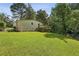 View of the backyard with a deck that is attached to the house at 1600 Belle Isle Ne Cir, Atlanta, GA 30329