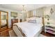 Main bedroom with bedside tables and hardwood floors at 1600 Belle Isle Ne Cir, Atlanta, GA 30329