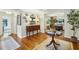 Elegant foyer with hardwood floors, stylish decor, and an inviting view into the kitchen and living areas at 1600 Belle Isle Ne Cir, Atlanta, GA 30329