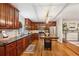 Traditional kitchen with hardwood floors, wood cabinets, stainless appliances and black granite countertops at 1600 Belle Isle Ne Cir, Atlanta, GA 30329