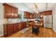 Traditional kitchen with hardwood floors, wood cabinets, stainless appliances and black granite countertops at 1600 Belle Isle Ne Cir, Atlanta, GA 30329