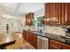 Traditional kitchen with stainless appliances and black granite countertops at 1600 Belle Isle Ne Cir, Atlanta, GA 30329