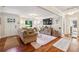 Inviting living room with hardwood floors, a plush sofa, natural light, and access to other areas at 1600 Belle Isle Ne Cir, Atlanta, GA 30329