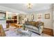 Spacious living room showcasing hardwood floors, fireplace, and seamless flow to the adjacent kitchen at 1600 Belle Isle Ne Cir, Atlanta, GA 30329